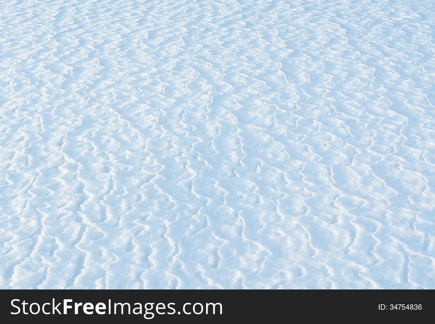 Surface of snowy field after a blizzard. Surface of snowy field after a blizzard