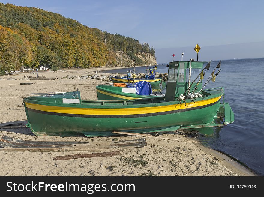 Small fishing boat on shore of the Baltic Sea in Gdynia, Poland. Small fishing boat on shore of the Baltic Sea in Gdynia, Poland