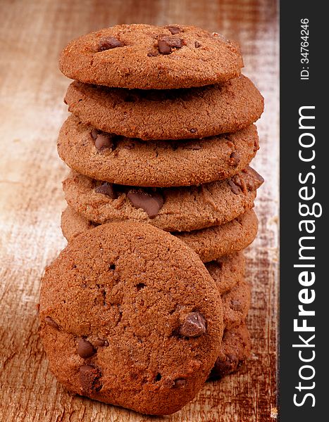 Stack of Christmas Chocolate Chip Cookies closeup on Wooden background