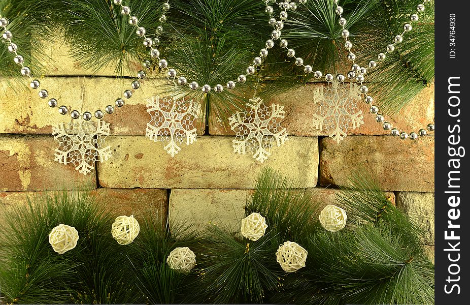 Christmas snowflakes with white baubles on chimney background. Christmas snowflakes with white baubles on chimney background