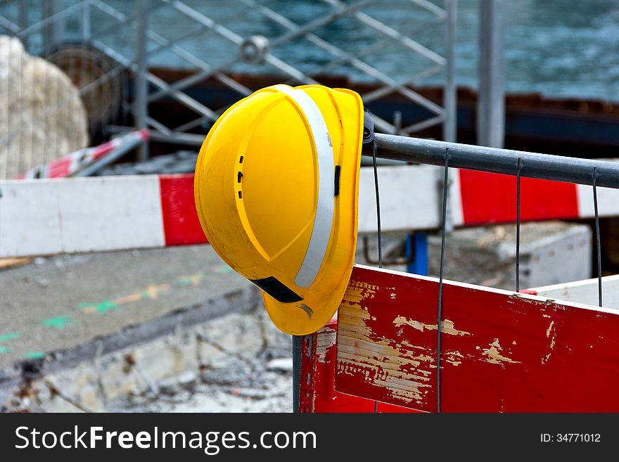 Helmet on a fence in focus in day