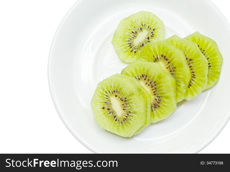 Kiwi fruits on white plate