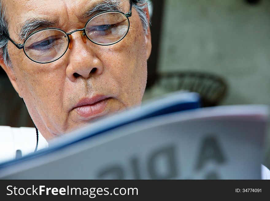 Senior Man Reading A Book