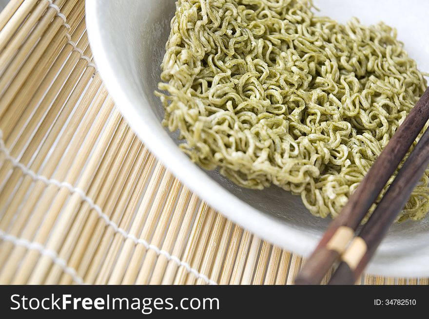 Close up green vegetable instant noodle. Close up green vegetable instant noodle