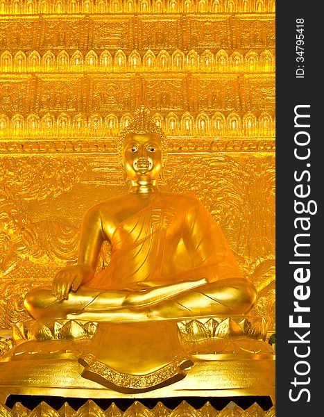 Golden buddha statue at the temple in Thailand.