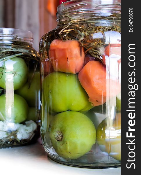 Jars with red white green homemade pickles