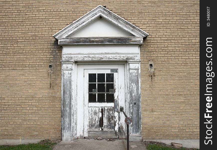 White old entry door of abandoned house