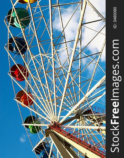 Carousel in the park against sky