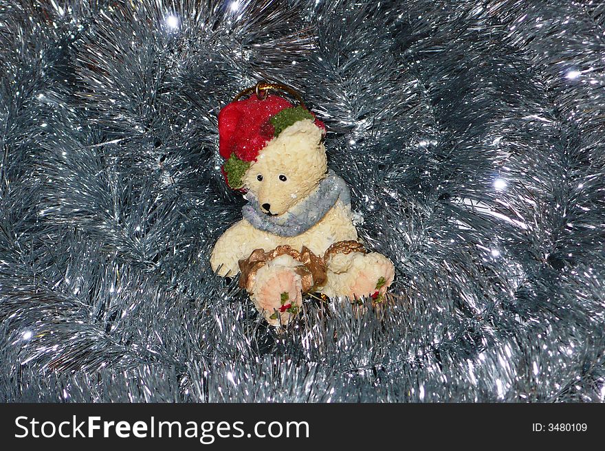 Nice Christmas Teddy bear, sitting on the bright rope. Nice Christmas Teddy bear, sitting on the bright rope