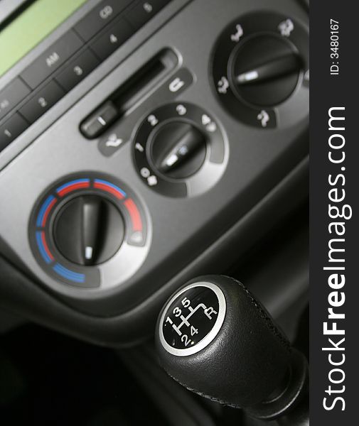 Gear handle and part of interior of modern family car (shallow dept)