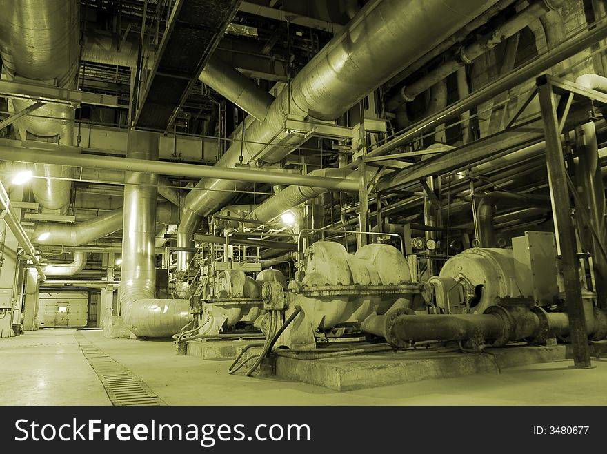 Different types of pipes and tanks inside energy plant. Different types of pipes and tanks inside energy plant