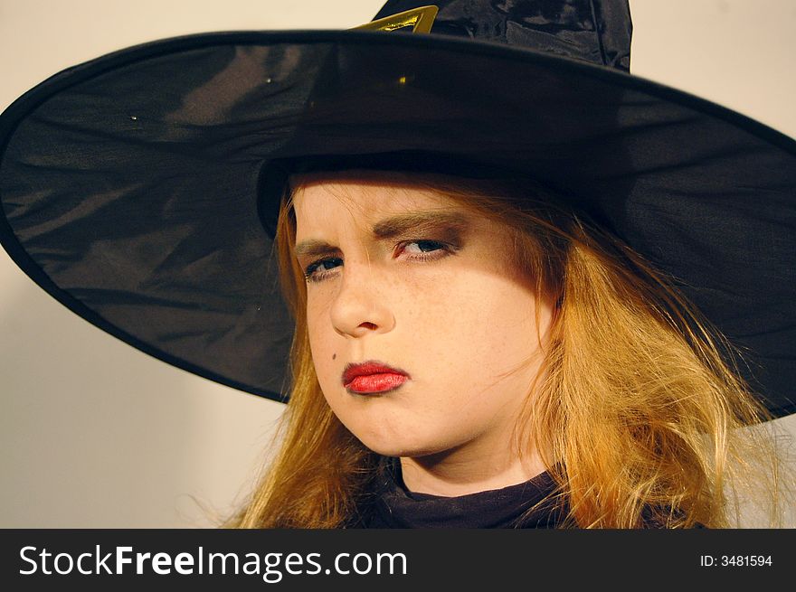 Young girl as a angry wicked witch. Young girl as a angry wicked witch