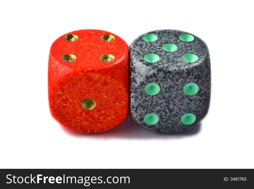 Red and green dice isolated on white