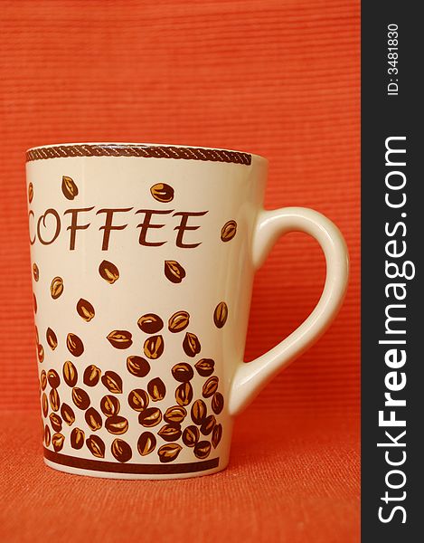 Beautiful coffee mug on red