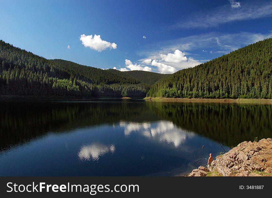 Fishing on the lake on a sunny day. Fishing on the lake on a sunny day