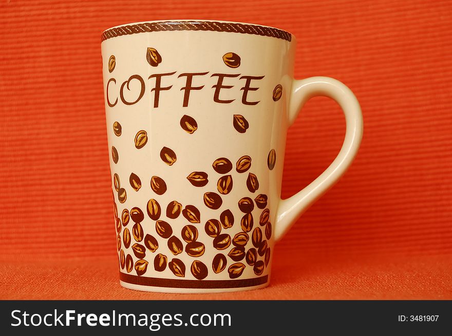 Beautiful coffee mug on red