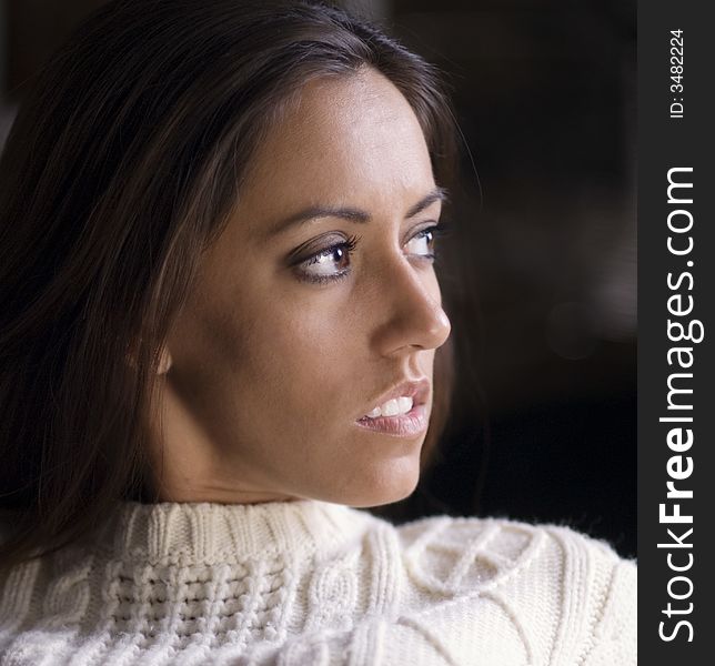 Portrait of a beautiful young woman in knitted woolley jumper knit