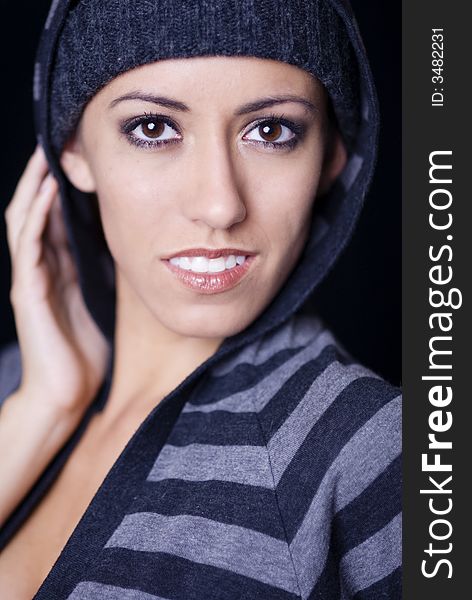 Fashion portrait of urban club girl in beanie. Fashion portrait of urban club girl in beanie