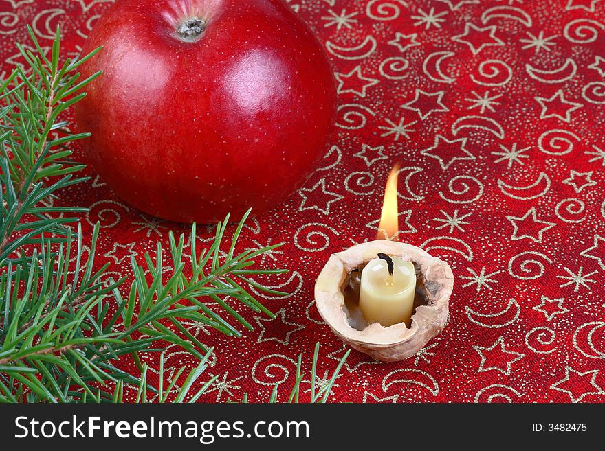 Christmas still life with apple and candle
