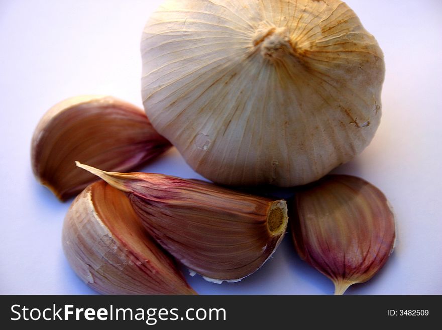 Close up photo of an onion and garlic