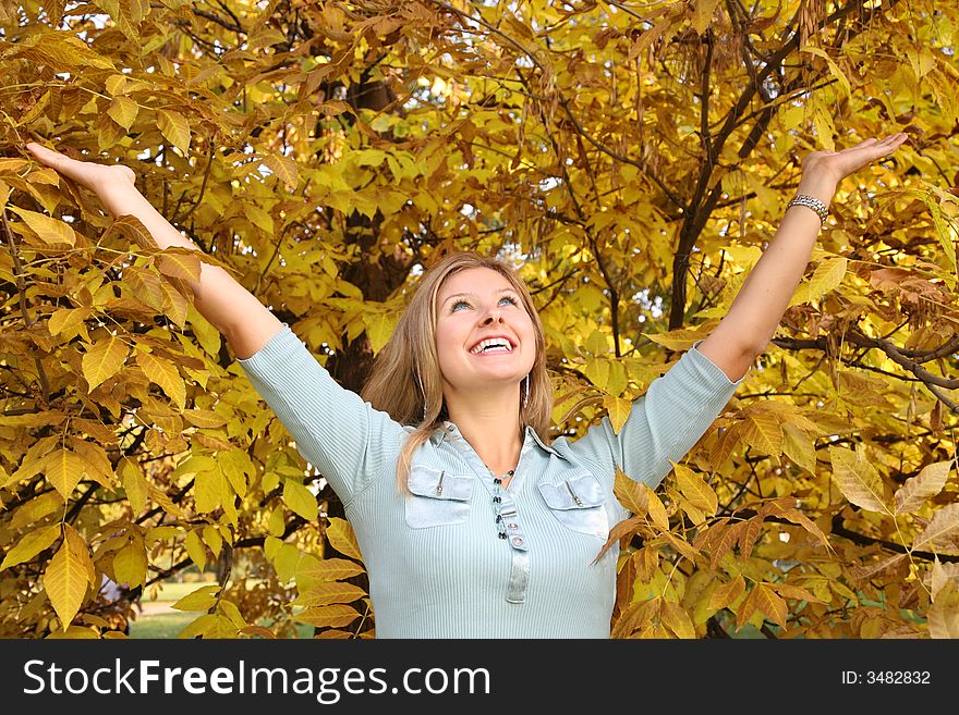 Blue-eyed blond among yellow leaves. Blue-eyed blond among yellow leaves