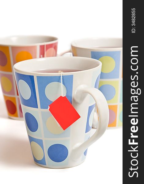Three painted cups on the white background. Three painted cups on the white background