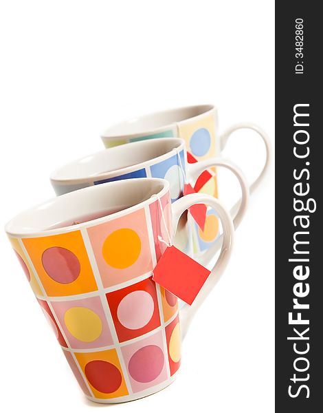 Three painted cups on the white background
