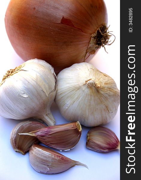 Close up photo of an onion and garlic