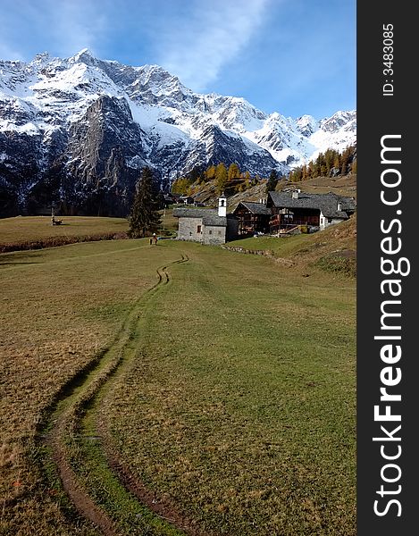 Mountain village during fall season; west Alps, Italy