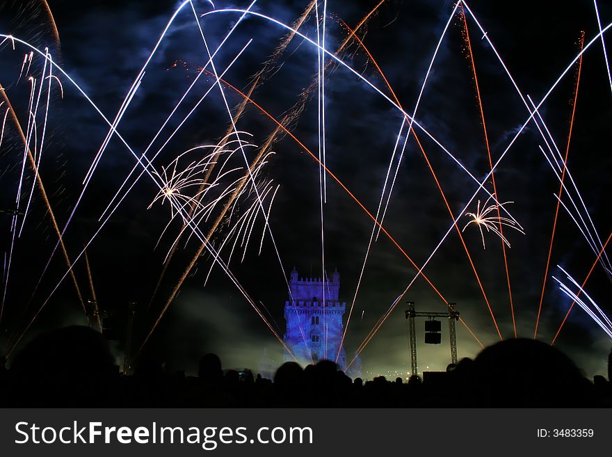 New year fireworks in the night in lisbon near tower belem, portugal