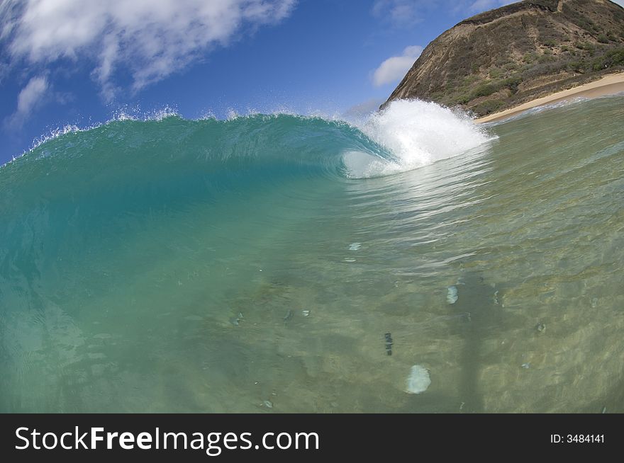 Giant wave breaking in shallow waters