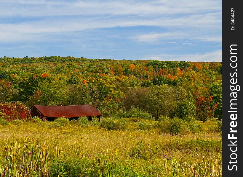Rusty old barn in an autumn field. Rusty old barn in an autumn field