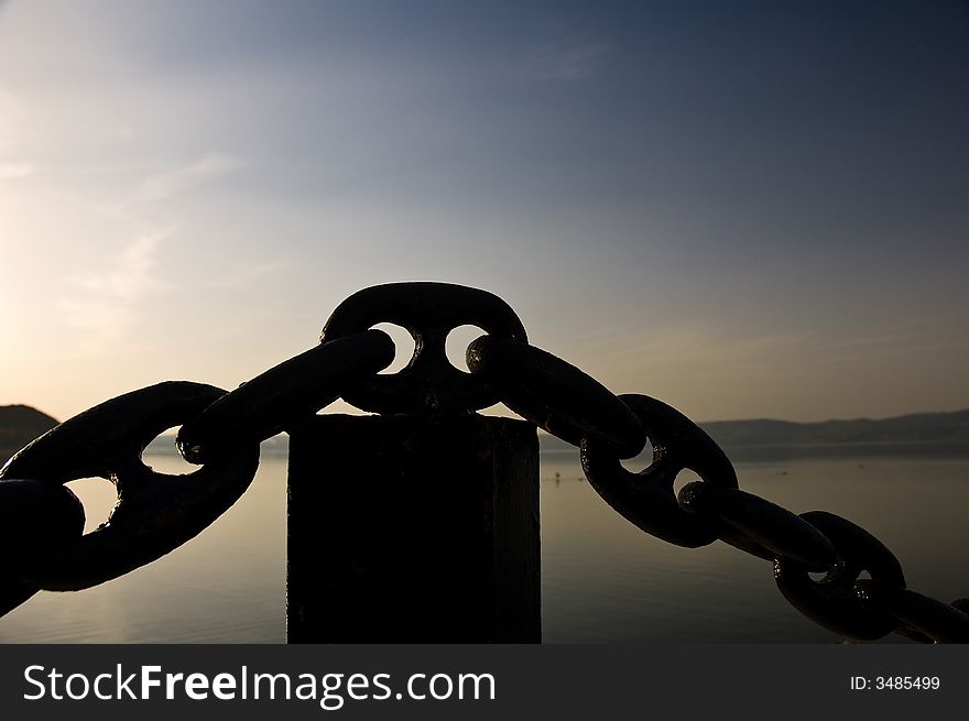 A big black chain with blue sky background