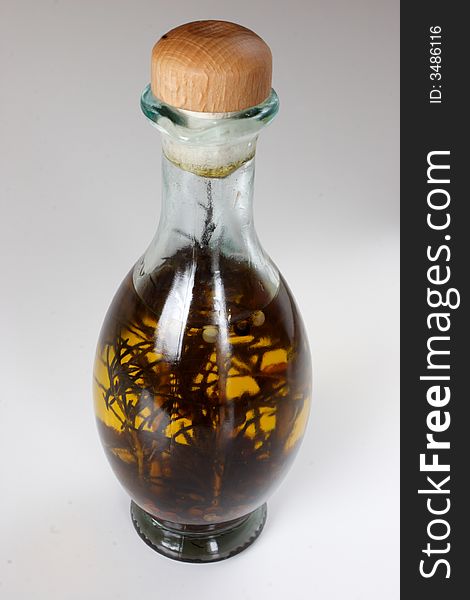 Bottle with spices in olive oil