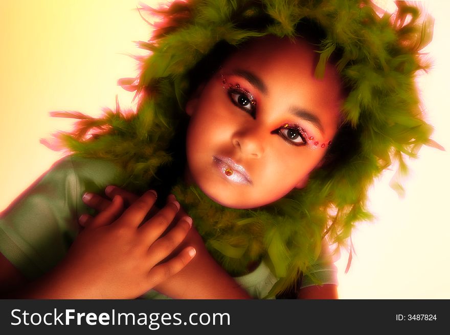 Beautiful ten year old african american girl in artsitic make-up. Beautiful ten year old african american girl in artsitic make-up.