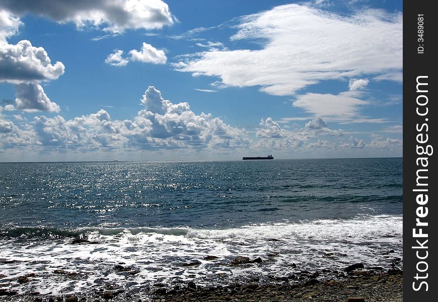 Black sea, seashore, cargo boat, clouds. Black sea, seashore, cargo boat, clouds