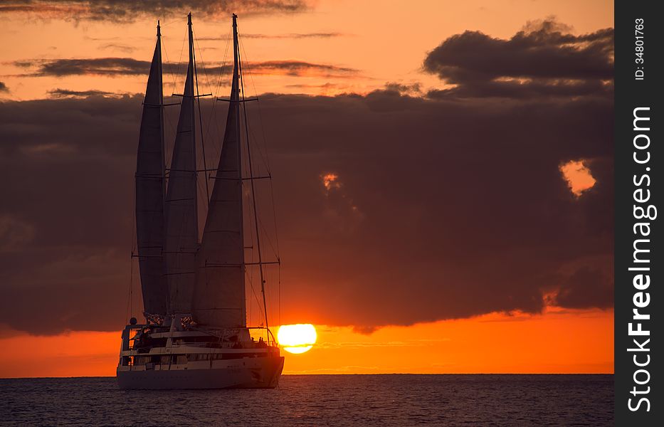 Big sailing yacht in Caribbean sea at sunset. Big sailing yacht in Caribbean sea at sunset