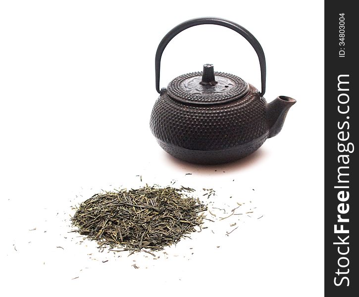 Green tea and a black japanese teapot