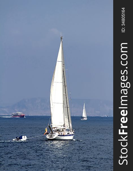 Sloop sailing in open waters. Sloop sailing in open waters