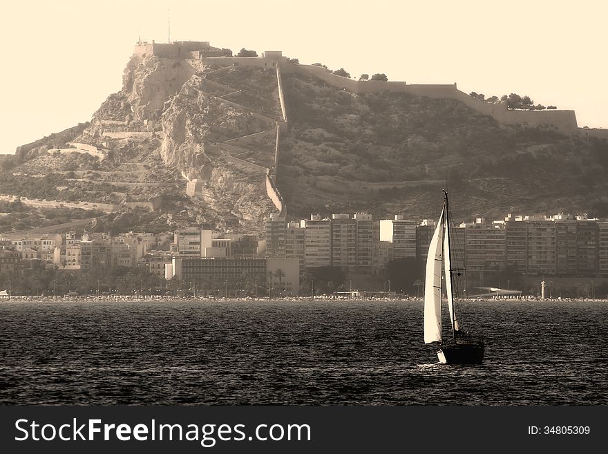 Sloop sailing close to Alicante coast. Sloop sailing close to Alicante coast