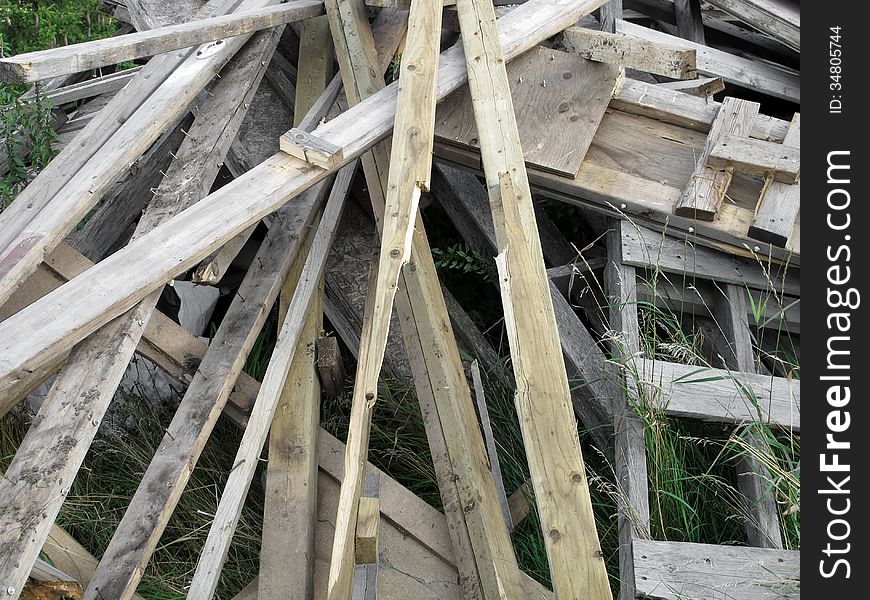 Pile of old, weathered, and used discarded wooden boards. Pile of old, weathered, and used discarded wooden boards.