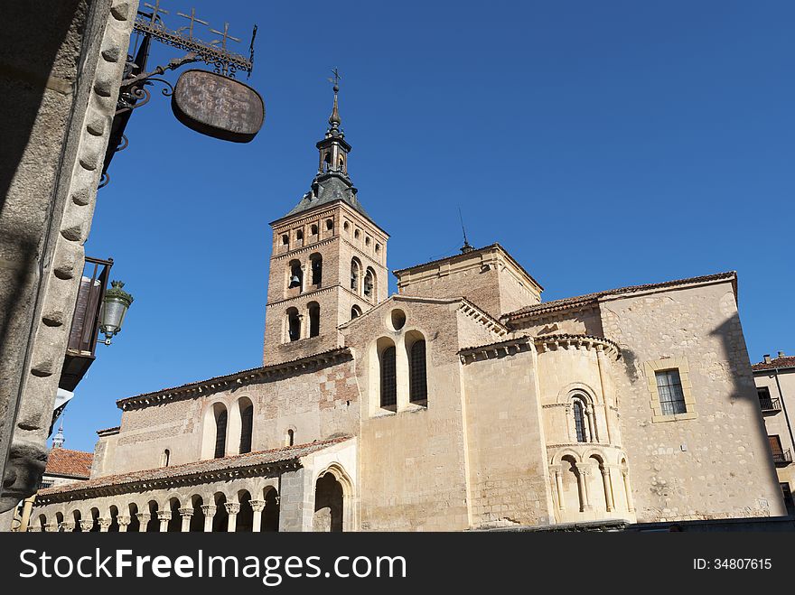 Side view of San Martin Church in Segovia, Spain, a Catholic temple erected in the XII century inside the city walls. Side view of San Martin Church in Segovia, Spain, a Catholic temple erected in the XII century inside the city walls.