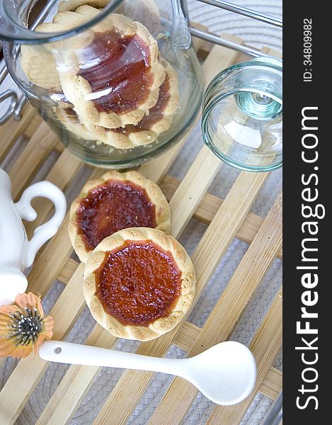 Open cookies jar on wooden tray