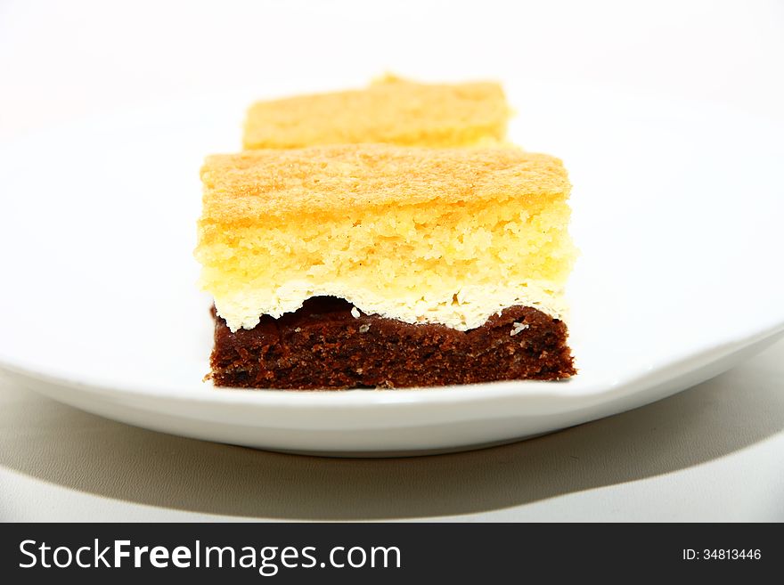 Two pieces of colored dessert on the plate