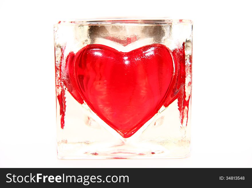 Red heart in glass isolated from background