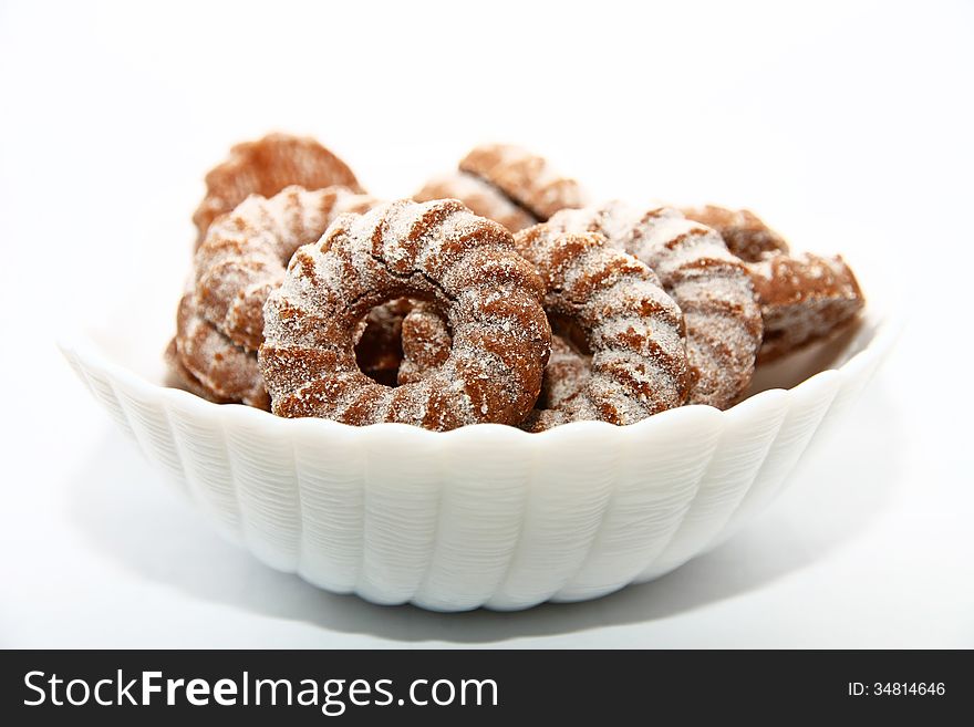 Biscuits sprinkled with brown sugar in a bowl. Biscuits sprinkled with brown sugar in a bowl