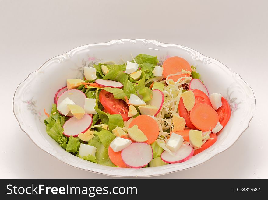 Vegetable salad for a healthy life served in ceramic bowls