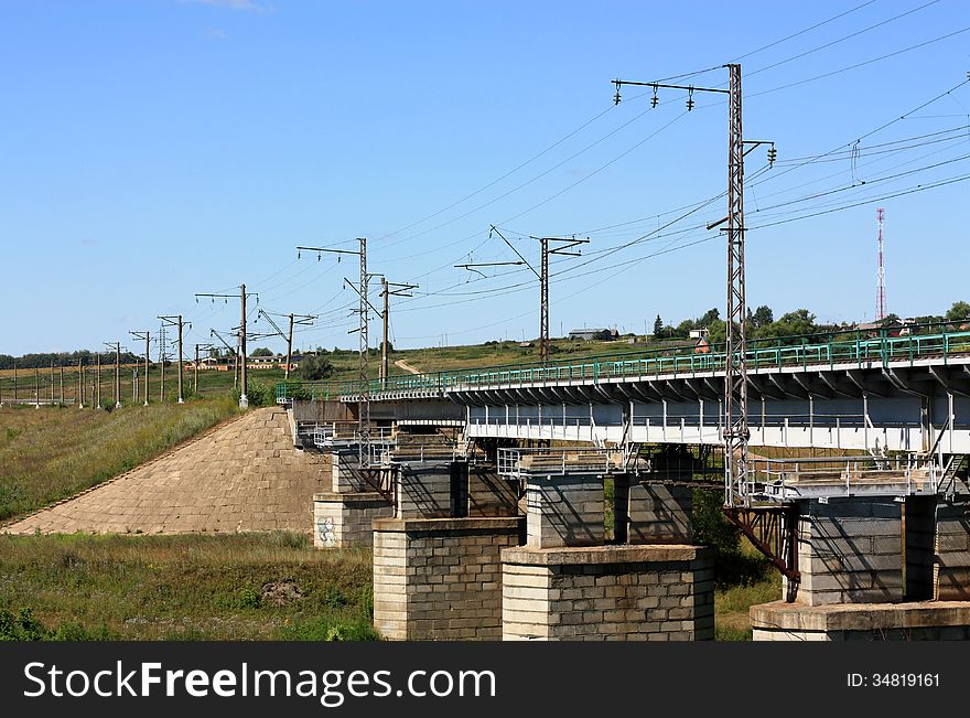 Railway bridge of electrified line with pillars