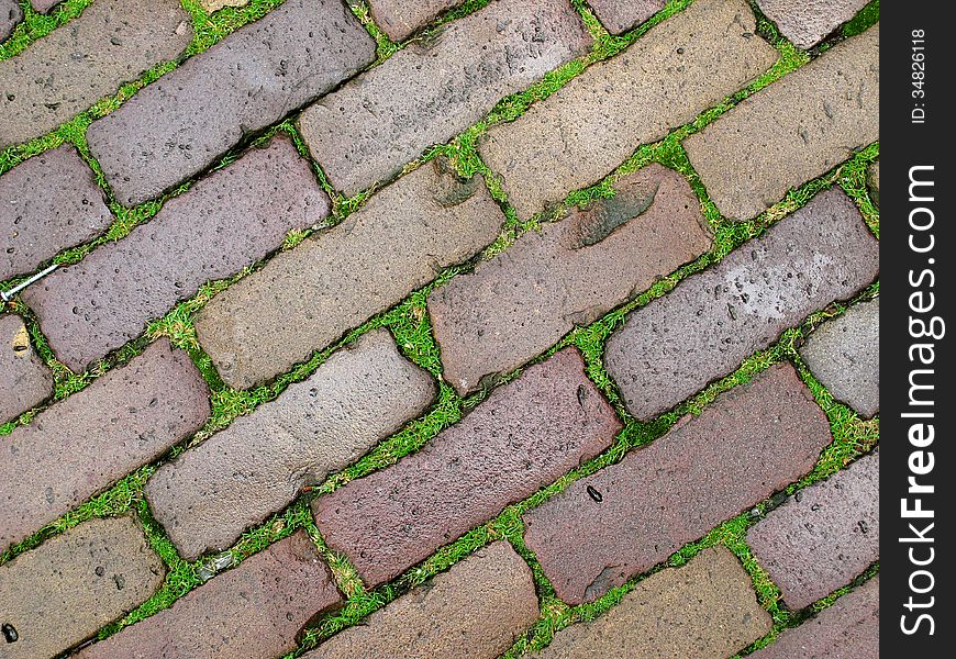 Old, wet tiles create interesting patterns; a dynamic diagonal shot. Old, wet tiles create interesting patterns; a dynamic diagonal shot