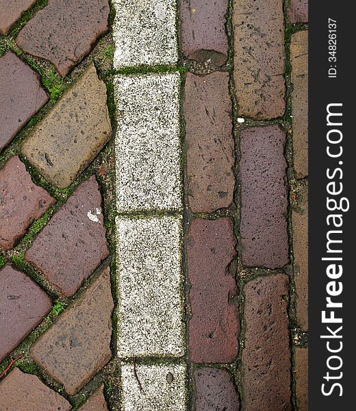 Old, wet tiles create interesting patterns. Vertical shot. Old, wet tiles create interesting patterns. Vertical shot